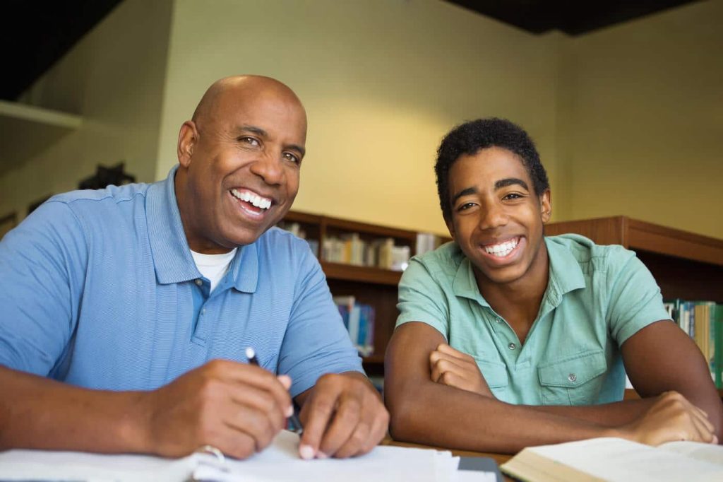parent and student studying together happily encouraging and supporting each other